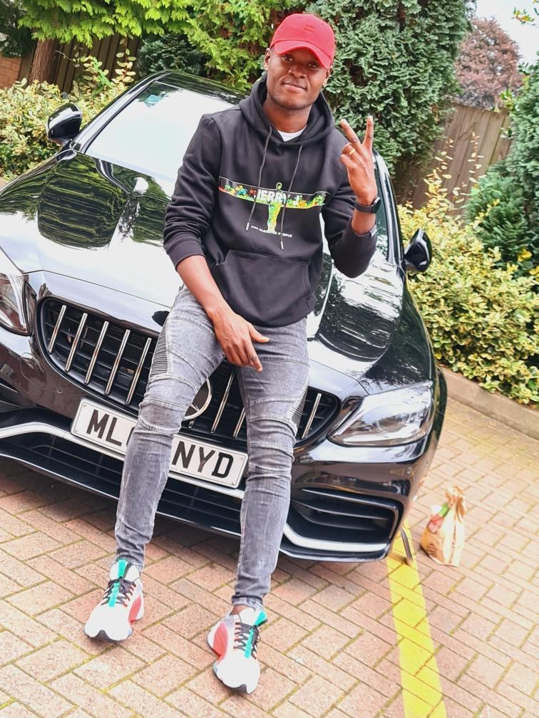 Aston Villa Fc Striker Ally Samatta wearing Jerry J Clothing angel of the north black hoodie
